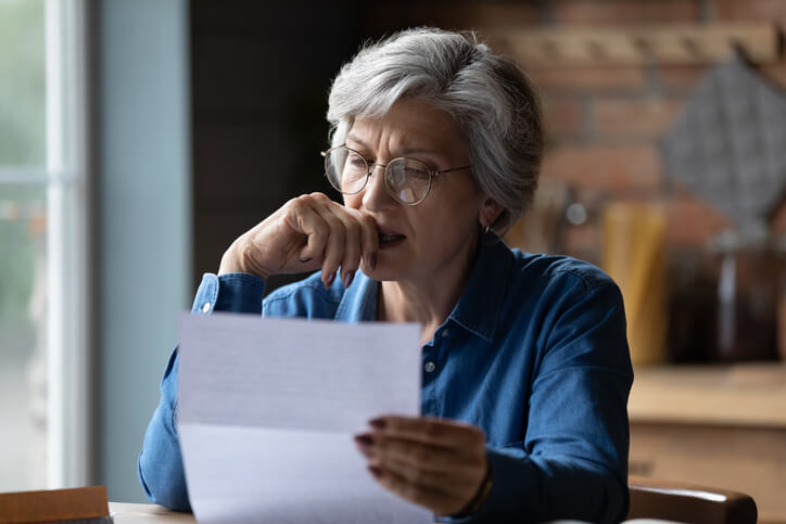 A person reading a document about their rights in a traffic ticket case